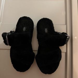 Black fuzzy Ugg slippers. Size 7